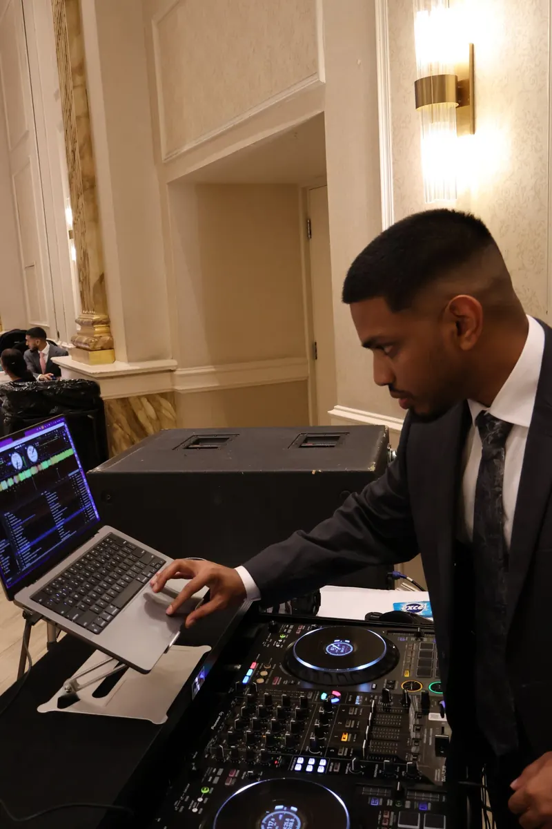 DJ Shadzy at the decks during a ballroom wedding reception