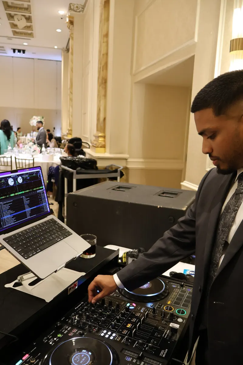 DJ Shadzy mixing at a formal ballroom event