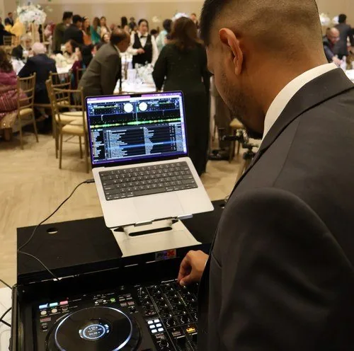 DJ Shadzy at the decks during a wedding reception